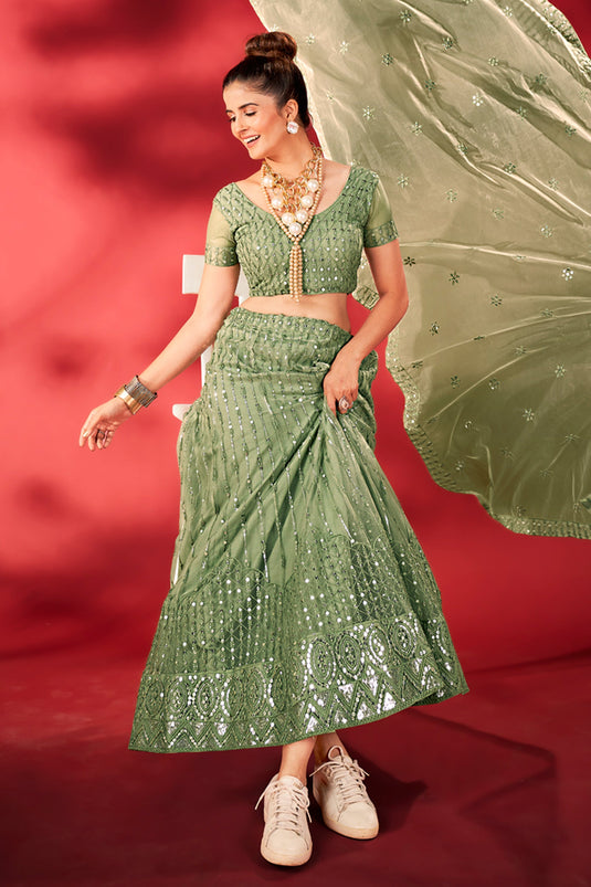 Ingenious Sequins Work Sea Green Color Net Fabric Lehenga