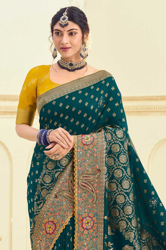 Attractive Weaving Designs Silk Saree In Teal Color