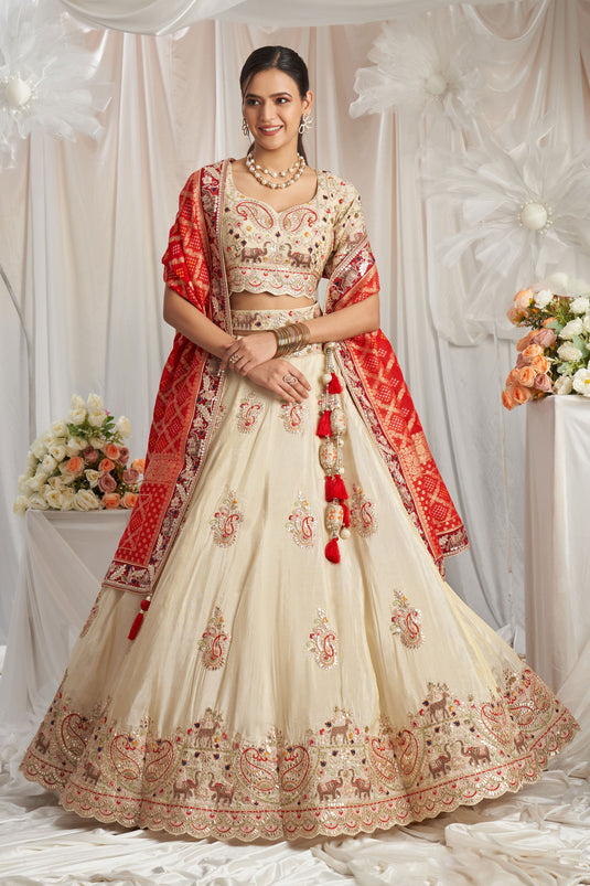 Flawless Tissue Thread Embroidery Cream And Red Lehenga Choli