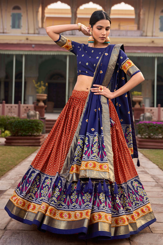 Art Silk Fabric Captivating Orange Color Patola Style Foil Printed Lehenga