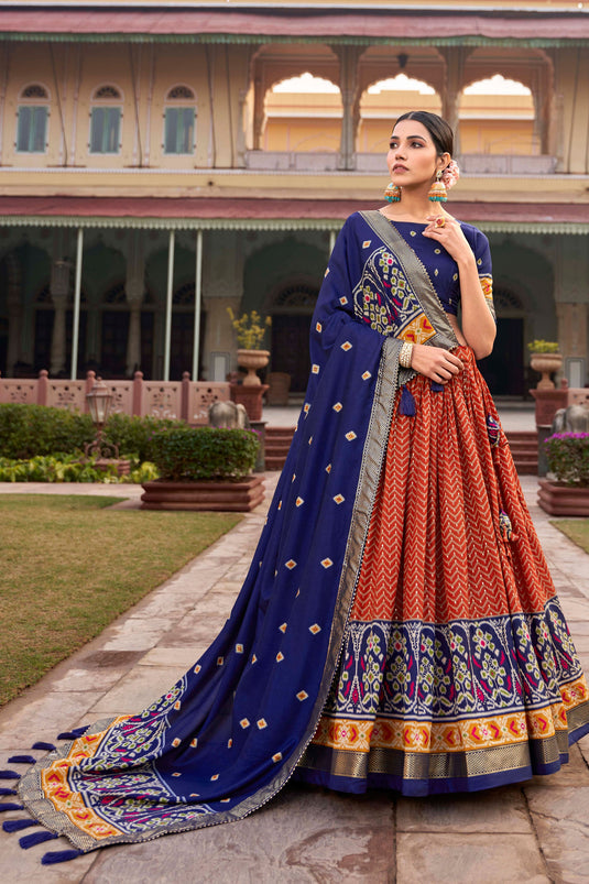 Art Silk Fabric Captivating Orange Color Patola Style Foil Printed Lehenga