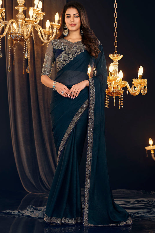 Creative Border Work On Teal Color Georgette Fabric Saree