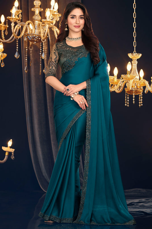 Beguiling Border Work On Teal Color Georgette Fabric Saree