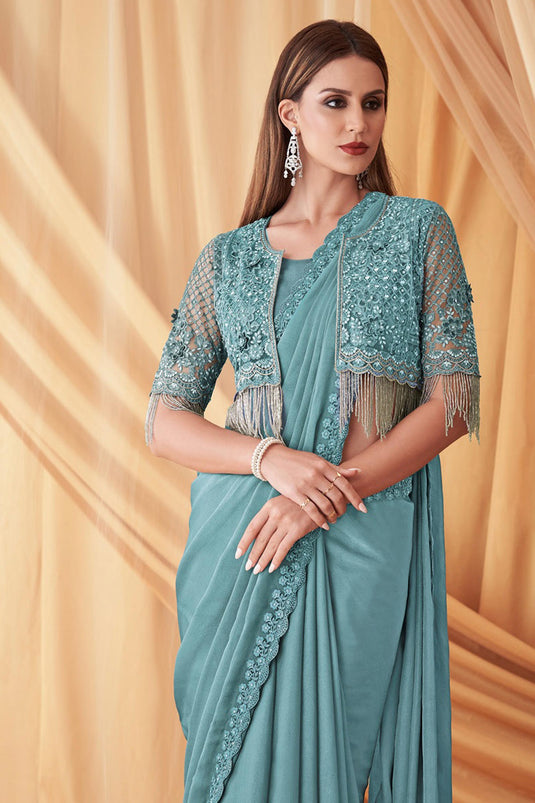 Larissa Bonesi Fashionable Cyan Color Satin Georgette Saree With Jacket