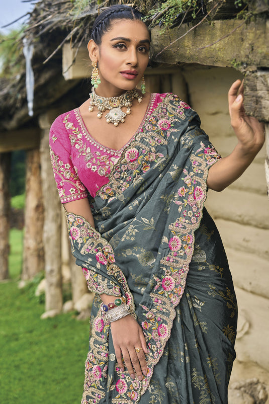 Vaishnavi Andhale Border Work Imposing Wedding Wear Dola Silk Saree In Grey Color