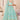 Sea Green Color Net Fabric Enticing Sequins Work Lehenga