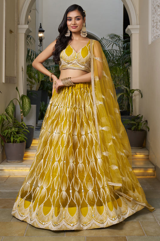 Stylish Mustard Color Net Fabric Sequins Embroidered Lehenga