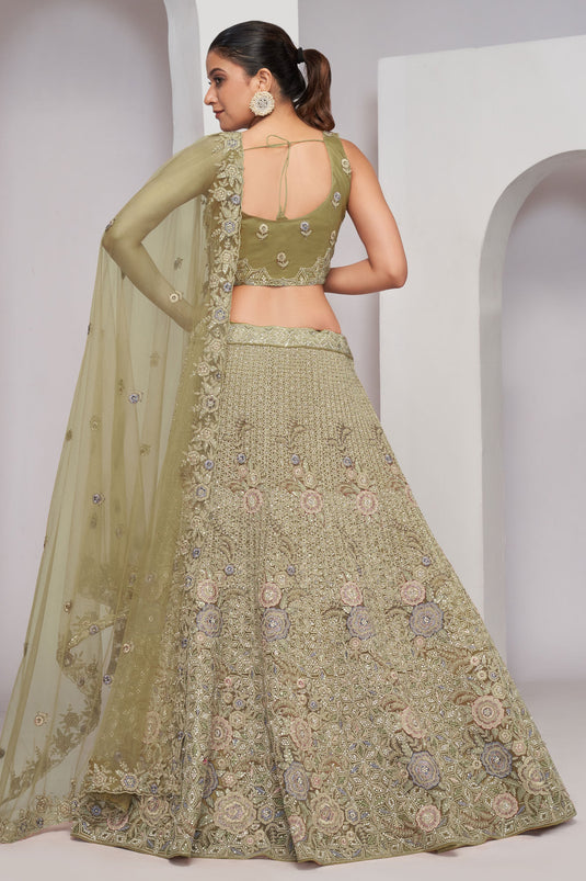 Sequins Work On Net Fabric Bewitching Lehenga In Olive Color