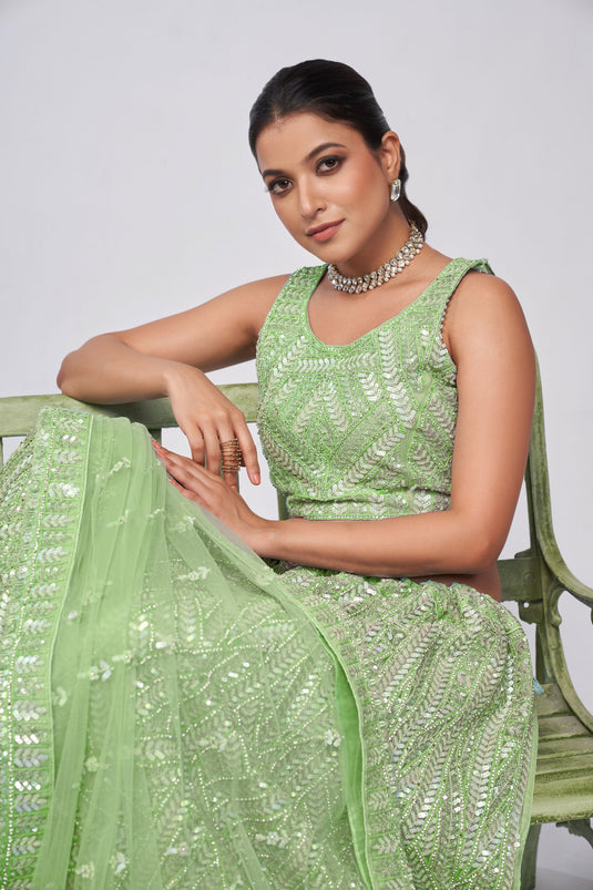 Marvellous Sequins Work On Net Fabric Lehenga In Sea Green Color