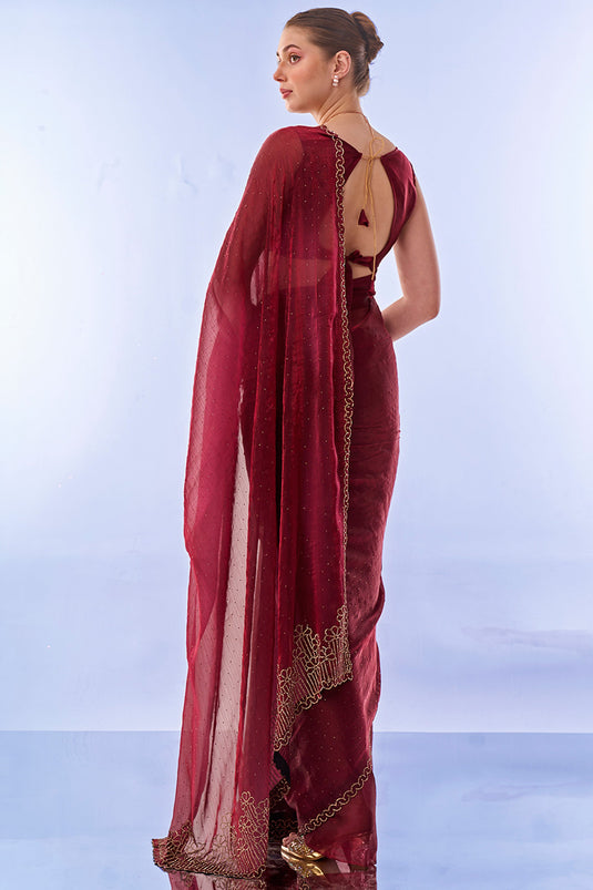 Phenomenal Swarovski work Maroon Color Fancy Fabric Saree