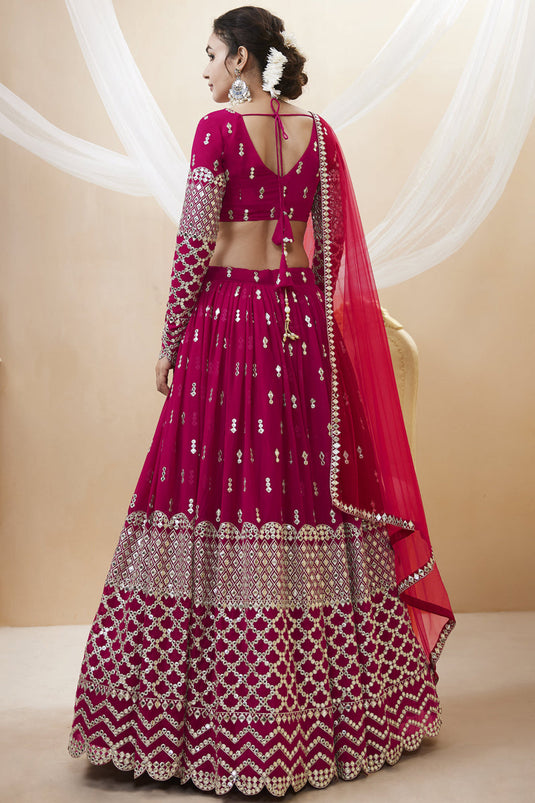 Tempting Georgette Fabric Rani Color Wedding Wear Lehenga Choli With Embroidered Work