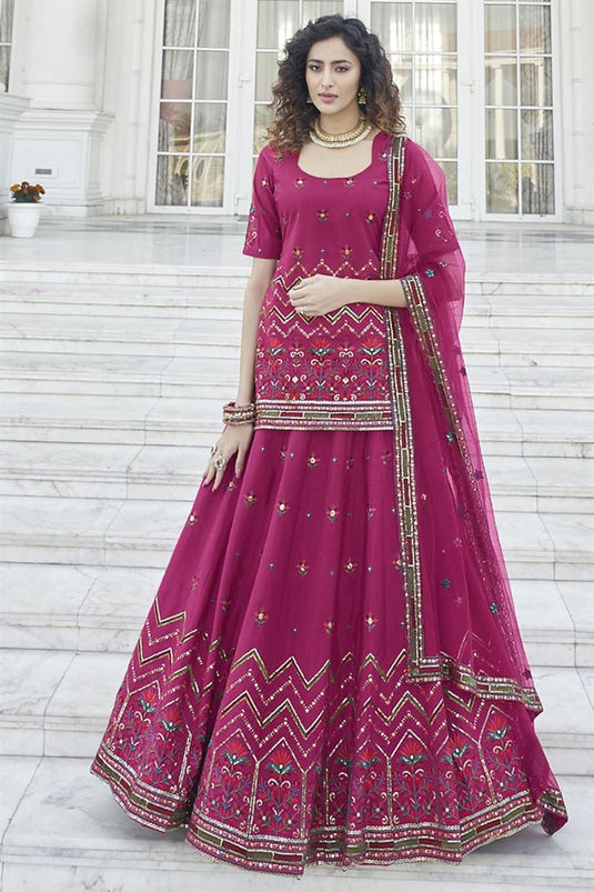 Superior Embroidered Work On Rani Color Function Wear Lehenga In Chinon Fabric