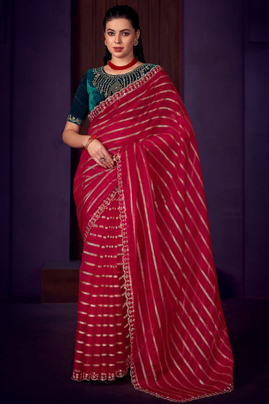 Function Wear Organza Fabric Stone Work Saree In Rani Color