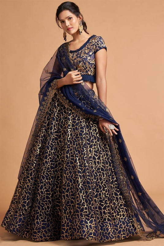 Sangeet Wear Net Fabric Classic Navy Blue Color Lehenga With Embroidered Designs