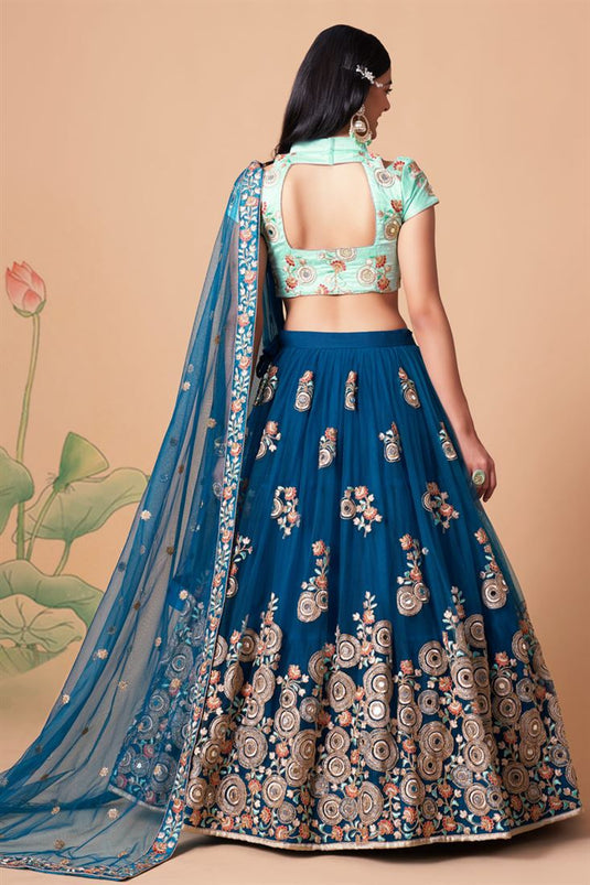 Radiant Sangeet Wear Blue Color Net Fabric Lehenga Choli