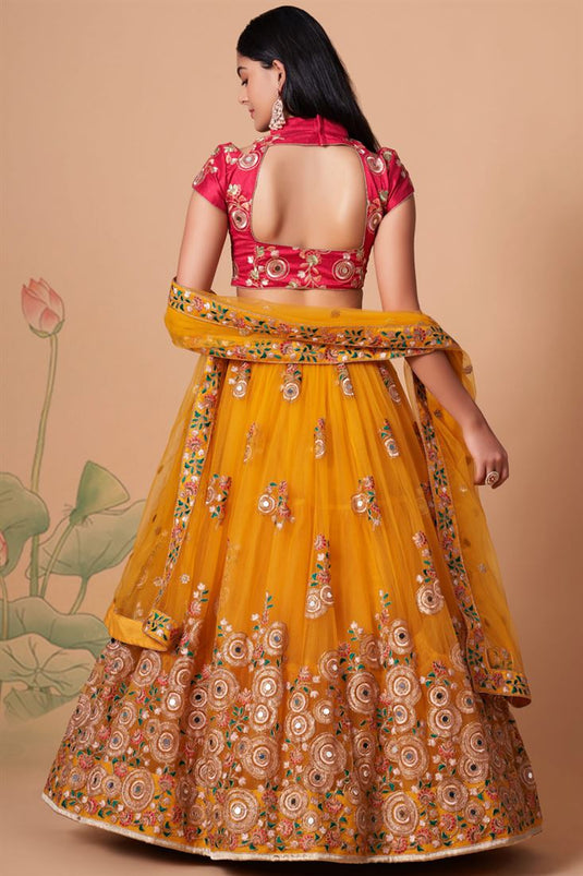 Tempting Net Fabric Yellow Color Lehenga Choli In Sangeet Wear