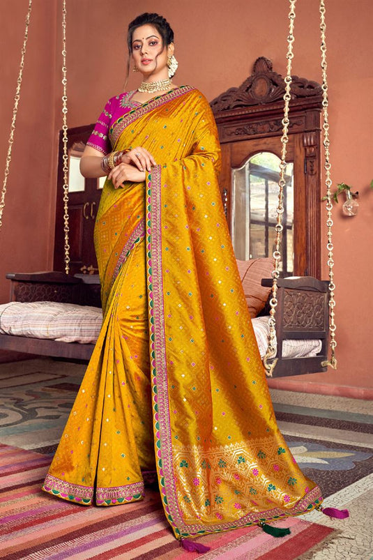 Enchanting Weaving Work On Mustard Color Art Silk Fabric Festive Wear Saree