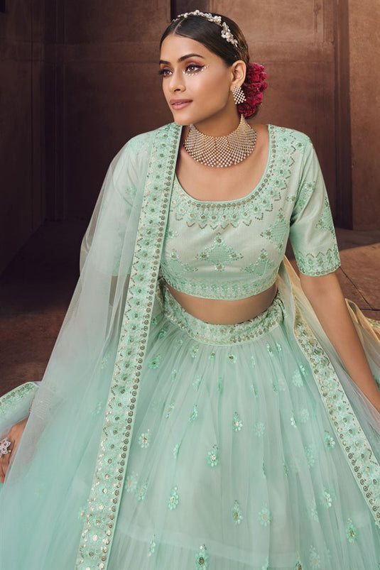 Excellent Net Fabric Sea Green Color Embroidered Work Lehenga