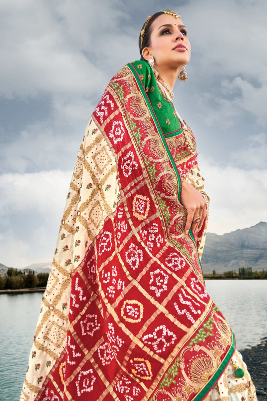 Appealing Pure Gajji Bandhani Satin Cream Color Saree With Heavy Embroidered Silk Blouse
