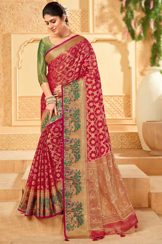 Tempting Organza Rani Color Saree With Weaving Work