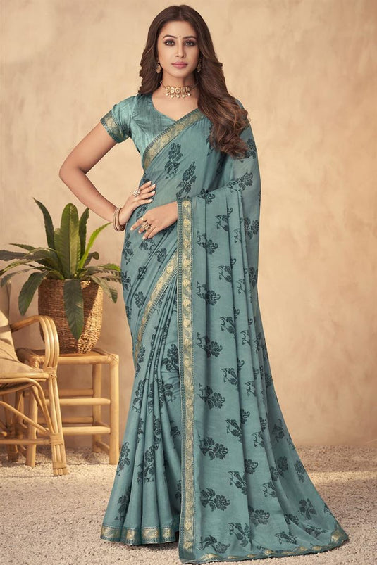 Marvellous Printed Work On Georgette Saree In Teal Color