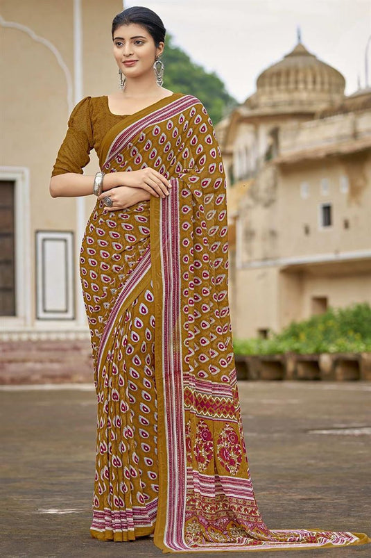 Georgette Fabric Mustard Color Inventive Printed Saree