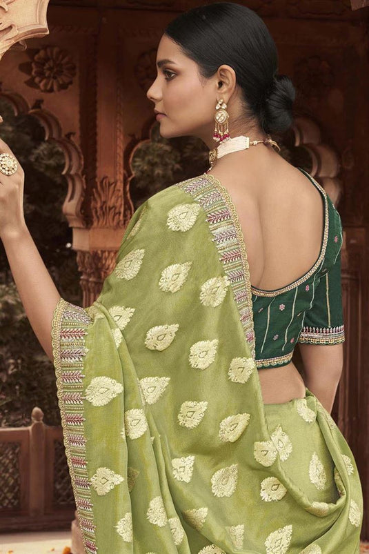 Engaging Olive Color Tissue Silk Saree With Embroidered Work