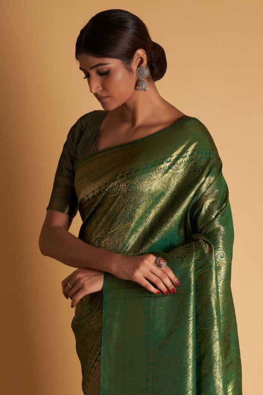 Wedding Wear Two Tone Kanjivaram Silk Fabric Weaving Work Saree In Dark Green Color