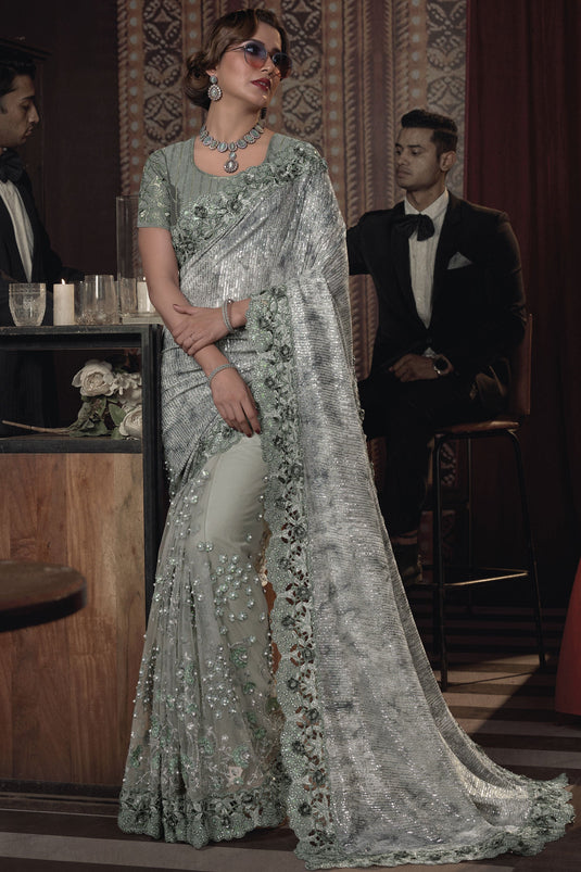 Heavy Embroidery Work Beguiling Sea Green Color Net Saree With Party Look Blouse