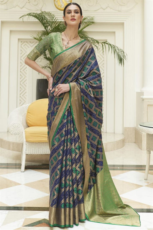 Patola Silk Fabric Embellished Festive Wear Saree In Blue Color