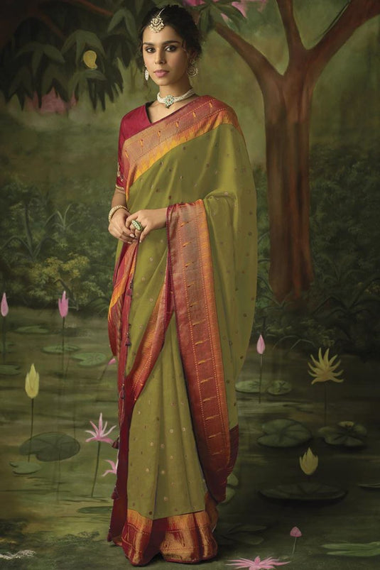 Captivating Brasso Fabric Printed Saree In Mehendi Green Color