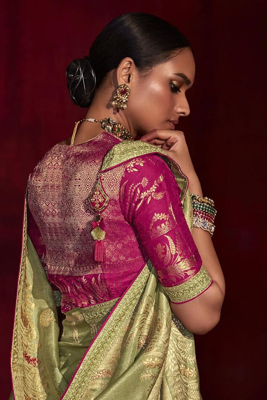 Fascinating Olive Color Art Silk Fabric Weaving Work Saree