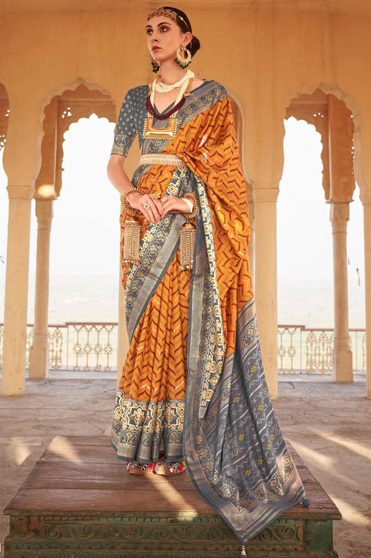 Patola Print Grey And Orange Silk Saree