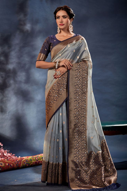 Delicate Weaving Work Grey Color Banarasi Organza Silk Saree