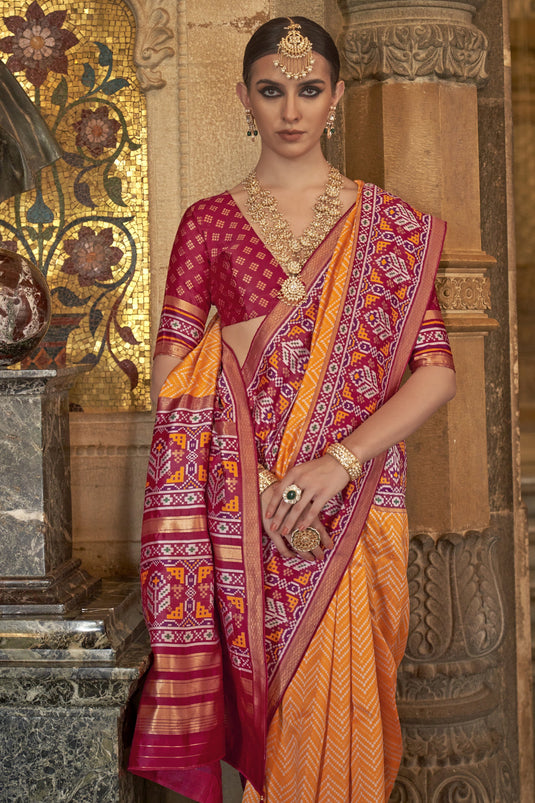 Dazzling Orange Color Art Silk Fabric Printed Function Wear Patola Saree