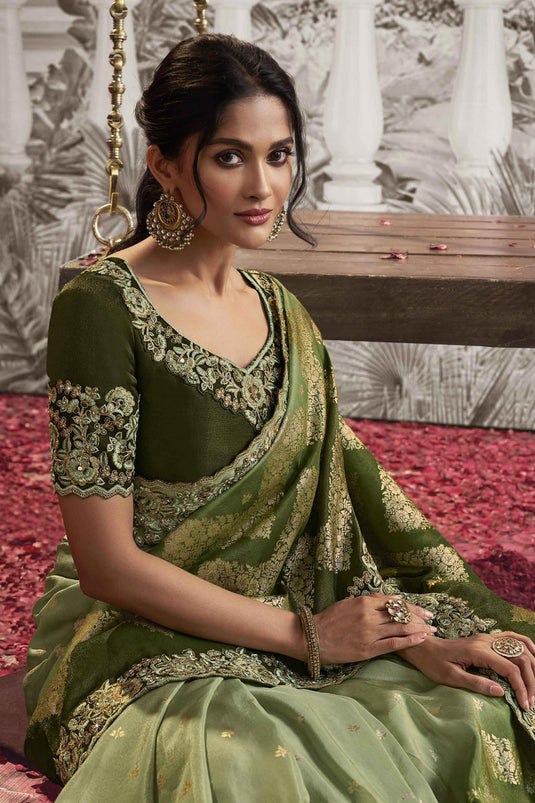 Delicate Green Color Heavy Embroidery Work Fancy Fabric Saree With Party Look Blouse