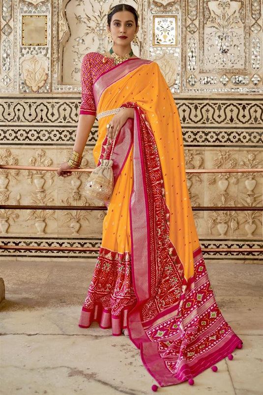 Mustard Color Function Wear Patola Printed Art Silk Fabric Charismatic Saree