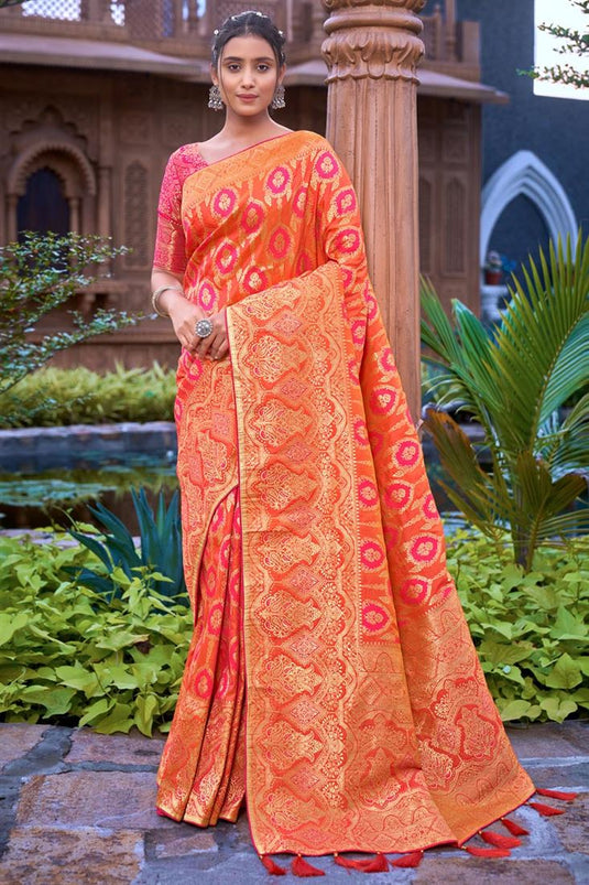 Banarsi Silk Fabric Embellished Weaving Work Orange Color Saree