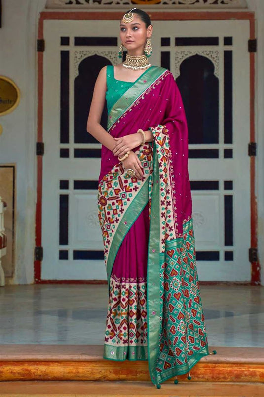 Patola Printed Captivating Art Silk Fabric Saree In Rani Color