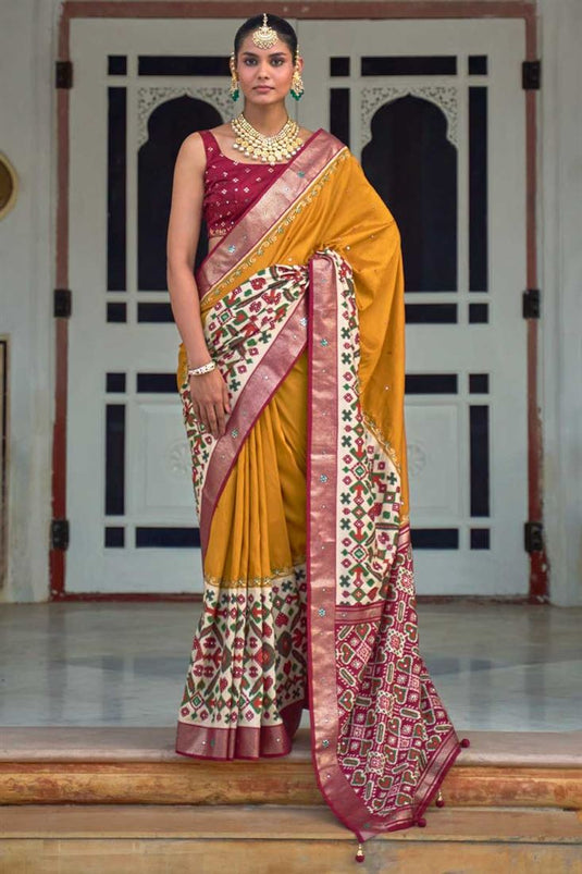 Patola Printed Lovely Art Silk Fabric Saree In Mustard Color