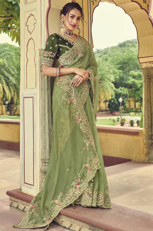 Border Work On Organza Fabric Bewitching Saree In Sea Green Color