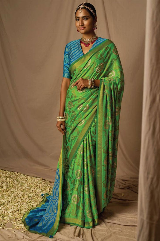 Incredible Weaving Work On Brasso Fabric Green Color Saree