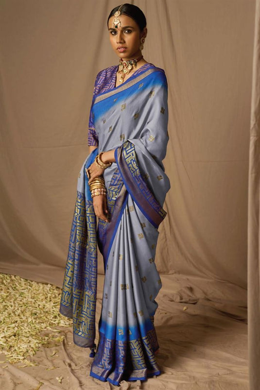 Tempting Brasso Fabric Blue Color Saree With Weaving Work