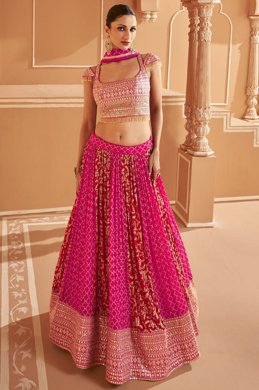 Embroidered Fancy Fabric Wedding Wear Readymade Lehenga In Rani With Ravishing Blouse