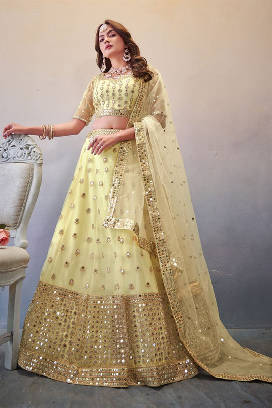 Net Fabric Sequins Work Luminous Lehenga In Cream Color