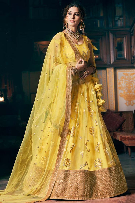 Net Fabric Yellow Color Lavish Sangeet Wear Embroidered Work Lehenga