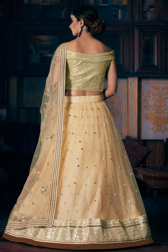 Magnificent Sangeet Wear Net Fabric Cream Color Embroidered Work Lehenga