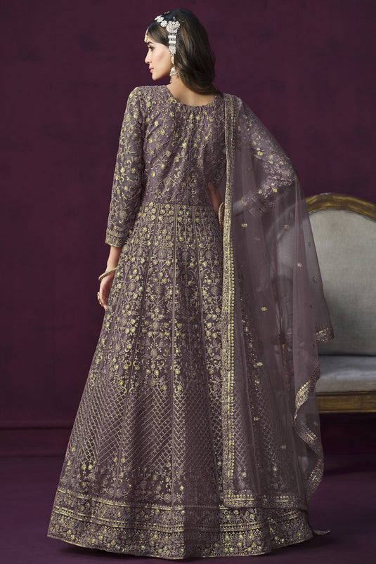 Attractive Embroidered Lavender Color Anarkali Salwar Kameez In Net Fabric