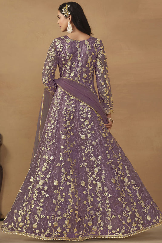 Net Fabric Function Wear Mesmeric Anarkali Suit In Lavender Color