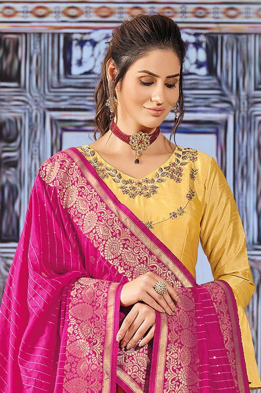 Beguiling Yellow Color Art Silk Fabric Savvy Suri Anarkali Suit With Contrast Dupatta